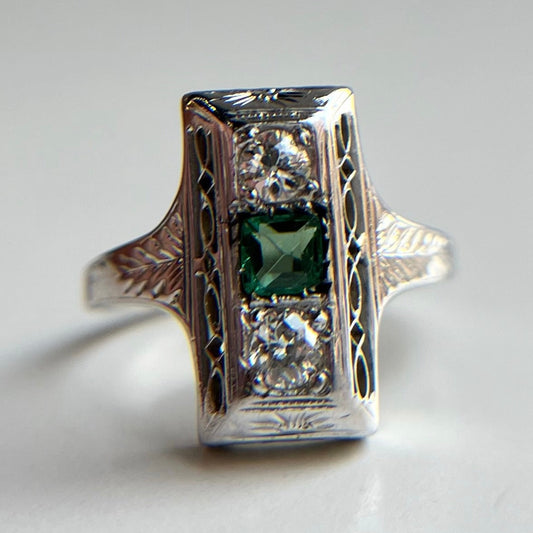 20k White Gold Diamond & Step Cut Emerald Ring